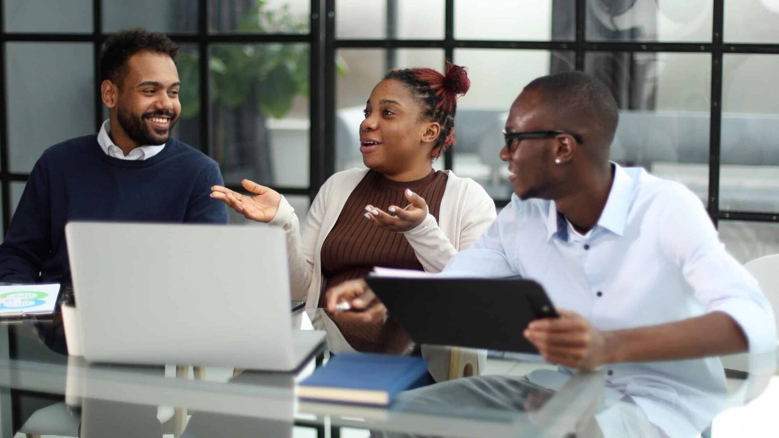 Business development team discussing strategy at a meeting table