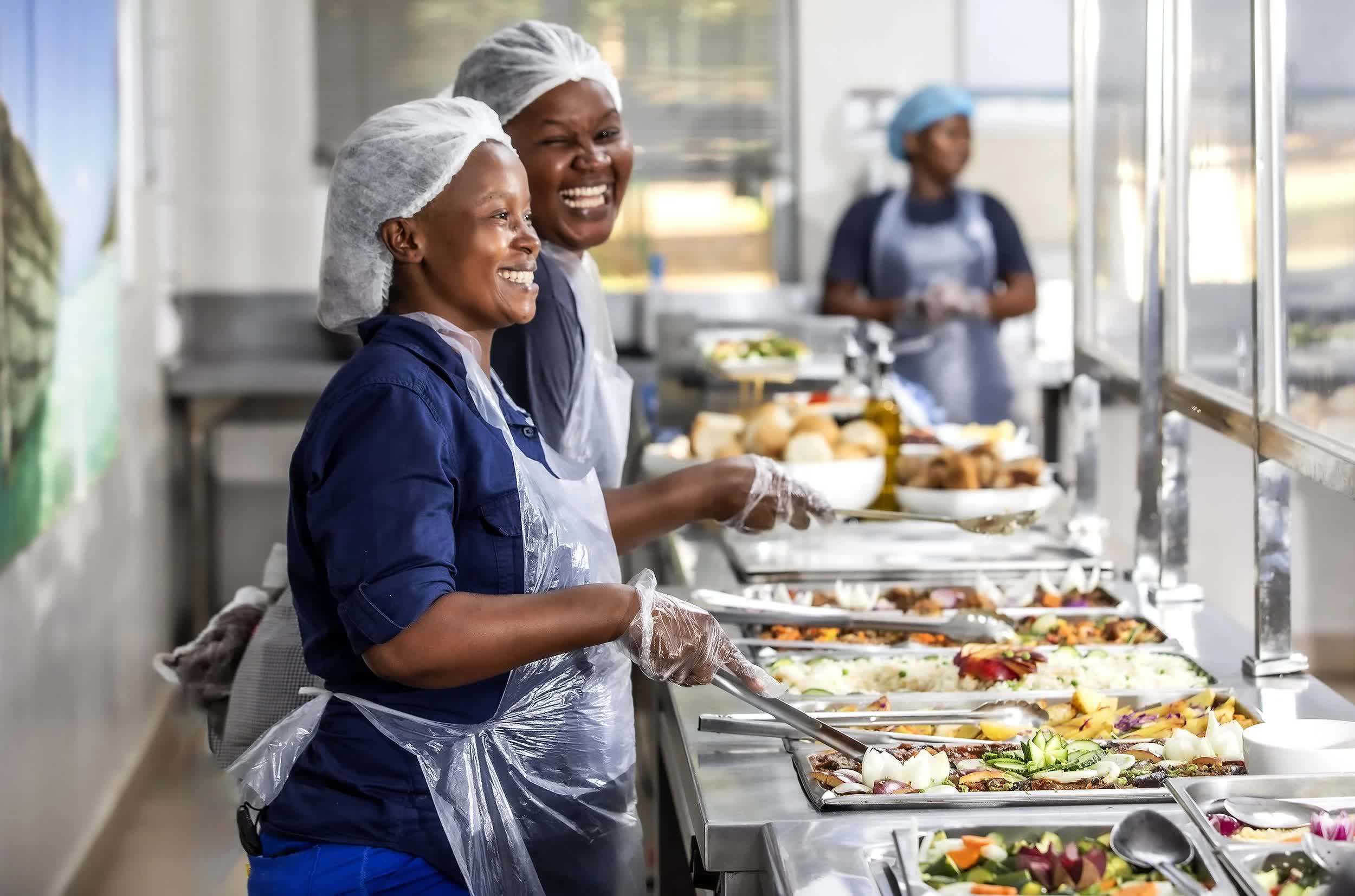 Isango catering staff serving a buffet event